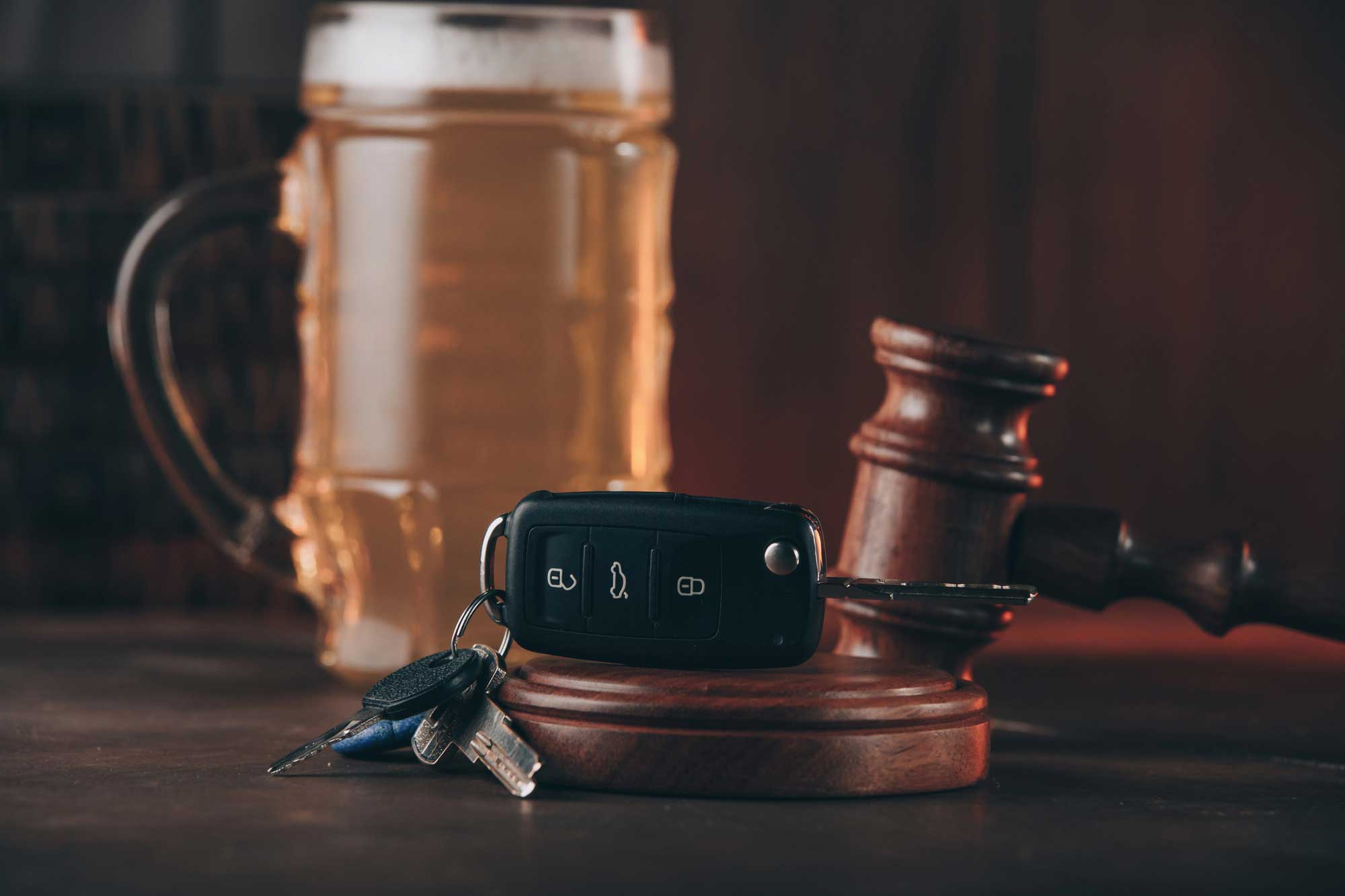 car keys by alcohol and gavel